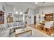 Bright living room featuring skylights, vaulted ceilings, hardwood floors, and an open layout at 5231 S Cody St, Littleton, CO 80123