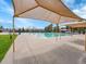 Large outdoor swimming pool with covered seating areas, perfect for community recreation and summer fun at 5231 S Cody St, Littleton, CO 80123