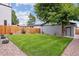 Landscaped backyard with spacious lawn and detached garage at 3908 Mariposa St, Denver, CO 80211