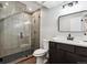 Modern basement bathroom with glass shower and dark vanity at 3908 Mariposa St, Denver, CO 80211