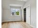 Light-filled bedroom with large closet and wood flooring at 3908 Mariposa St, Denver, CO 80211