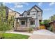 Stunning two-story home with modern gray exterior and landscaped front yard at 3908 Mariposa St, Denver, CO 80211