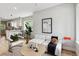 Open concept living room with modern white couch and coffee table at 3908 Mariposa St, Denver, CO 80211