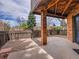Backyard patio featuring brick pillar and wooden fence at 2615 Oak Dr # 5, Lakewood, CO 80215