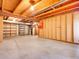 Unfinished basement with exposed ceiling and concrete floor with shelving at 2615 Oak Dr # 5, Lakewood, CO 80215