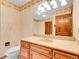 Bathroom with a large vanity with lots of storage and tile backsplash at 2615 Oak Dr # 5, Lakewood, CO 80215