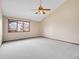 Bright bedroom with ceiling fan, window views, soft carpet, and neutral color palette at 2615 Oak Dr # 5, Lakewood, CO 80215
