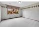 Bedroom featuring a large window with decorative curtains and plenty of natural light at 2615 Oak Dr # 5, Lakewood, CO 80215