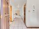 Bright foyer with tile flooring and neutral walls leads to a spacious living area with a fireplace at 2615 Oak Dr # 5, Lakewood, CO 80215