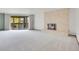 Spacious living room featuring a brick fireplace and sliding glass doors leading to the back deck at 2615 Oak Dr # 5, Lakewood, CO 80215