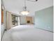 Spacious living room featuring a brick fireplace, a large glass slider, and soft carpeting at 2615 Oak Dr # 5, Lakewood, CO 80215