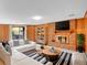 Cozy living room with a brick fireplace, built-in shelves, a comfortable sofa, and stylish decor at 2615 Oak Dr # 5, Lakewood, CO 80215