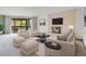 Spacious living room with a fireplace and sliding glass doors, furnished with modern decor at 2615 Oak Dr # 5, Lakewood, CO 80215