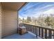 Cozy balcony featuring a barbeque grill, with views of a quiet neighborhood on a partially cloudy day at 6504 Ralston Rd # A, Arvada, CO 80002