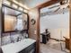 Nicely done bathroom with modern fixtures, vanity, and access to loft space at 6504 Ralston Rd # A, Arvada, CO 80002