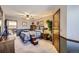 Bedroom featuring a striped comforter, wooden furniture, and a cozy atmosphere at 6504 Ralston Rd # A, Arvada, CO 80002