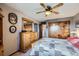 Cozy bedroom with a spacious closet, dresser, and wood-look ceiling fan for added comfort at 6504 Ralston Rd # A, Arvada, CO 80002