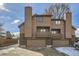 Two-story townhome showcases a well-maintained exterior with a private balcony and garage at 6504 Ralston Rd # A, Arvada, CO 80002