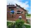 Charming multi-level house with a deck, brown siding and attractive landscaping at 6504 Ralston Rd # A, Arvada, CO 80002