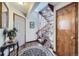 Elegant foyer with staircase, hardwood floors and a decorative rug at 6504 Ralston Rd # A, Arvada, CO 80002