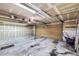 Spacious two car garage featuring a workbench, storage shelves and natural lighting at 6504 Ralston Rd # A, Arvada, CO 80002