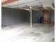 Spacious two car garage featuring concrete floor and neutral-painted walls at 6504 Ralston Rd # A, Arvada, CO 80002