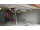 Spacious two car garage with concrete floor, gray walls, and door to interior at 6504 Ralston Rd # A, Arvada, CO 80002