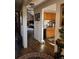 Spacious hallway leading to a kitchen and living room with warm, wood-look floors at 6504 Ralston Rd # A, Arvada, CO 80002