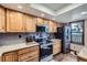 Modern kitchen with stainless steel appliances, light cabinets, and a view to the outdoors at 6504 Ralston Rd # A, Arvada, CO 80002