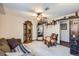 Relaxing living room featuring a grandfather clock, mirror, shelving, a comfortable chair, and nice decor at 6504 Ralston Rd # A, Arvada, CO 80002