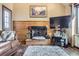Living room featuring a wood trimmed fireplace and comfortable seating at 6504 Ralston Rd # A, Arvada, CO 80002
