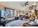 Cozy living room with a vaulted ceiling, large window, wood floors and comfortable seating at 6504 Ralston Rd # A, Arvada, CO 80002