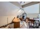Home office space features wood desk, chair, overhead lighting, and natural light at 6504 W 58Th Ave # A, Arvada, CO 80002