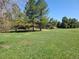 Expansive backyard with mature trees, partially fenced, perfect for outdoor activities and enjoyment at 5521 Colorow Dr, Morrison, CO 80465