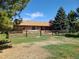 View of backyard with fence, patio area, and hammock at home at 5521 Colorow Dr, Morrison, CO 80465