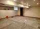 Unfinished basement featuring exposed ceiling beams and concrete flooring, offering ample space for renovation at 5521 Colorow Dr, Morrison, CO 80465