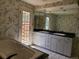 Bathroom with double sink vanity, large mirror and jacuzzi tub at 5521 Colorow Dr, Morrison, CO 80465