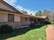 Ranch home with walkway and porch, painted in neutral colors with brick accents at 5521 Colorow Dr, Morrison, CO 80465