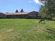 Beautiful front yard and single-story home with deer, showcasing the peaceful setting at 5521 Colorow Dr, Morrison, CO 80465