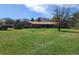 Well-maintained front yard and charming single-story home with mountain views in the background at 5521 Colorow Dr, Morrison, CO 80465