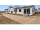 The backyard of this house is still under construction at 9072 Telluride Ct, Commerce City, CO 80022