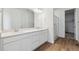 Bright bathroom featuring double vanity and glass enclosed shower at 9072 Telluride Ct, Commerce City, CO 80022