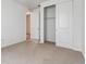 Bright bedroom with closet and neutral carpet at 9072 Telluride Ct, Commerce City, CO 80022