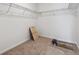Walk-in closet with wire shelving and neutral carpet at 9072 Telluride Ct, Commerce City, CO 80022