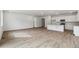 Expansive living area with hardwood floors and combined kitchen, providing ample space at 9072 Telluride Ct, Commerce City, CO 80022