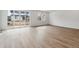 Bright living area with hardwood floors and sliding glass doors opening to backyard at 9072 Telluride Ct, Commerce City, CO 80022