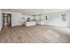 Spacious open floor plan combining kitchen, living, and dining areas with hardwood floors at 9072 Telluride Ct, Commerce City, CO 80022