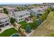 Aerial view of a home with a lush backyard, a putting green, and an outdoor entertainment area at 10738 Braesheather Ct, Highlands Ranch, CO 80126