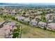 Sweeping aerial view of a suburban neighborhood with well-maintained homes and green spaces at 10738 Braesheather Ct, Highlands Ranch, CO 80126