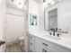 Bright bathroom featuring a modern vanity, fixtures, flooring, and shower with a shower curtain at 10738 Braesheather Ct, Highlands Ranch, CO 80126
